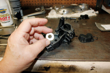 A hand holding the washer